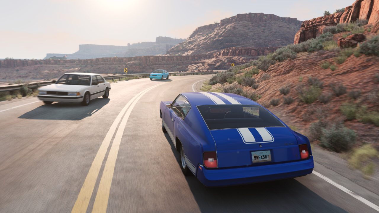 Auto in corsa su una strada nel canyon in BeamNG.drive