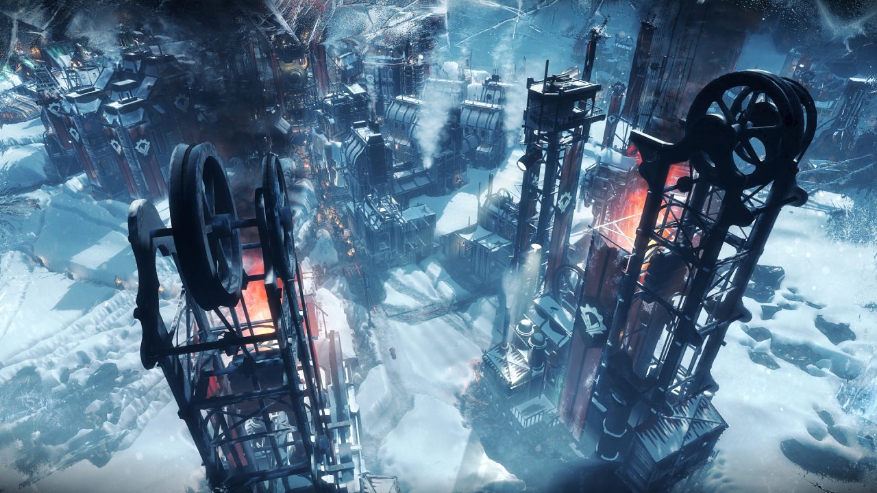 Veduta dall'alto delle strutture industriali di Frostpunk, in arrivo su Switch