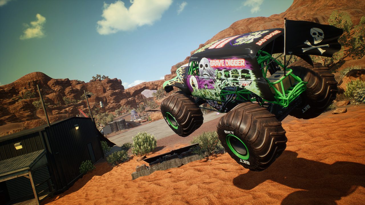 Platino di Monster Jam Steel Titans: un monster truck verde in volo tra le rocce rosse del deserto