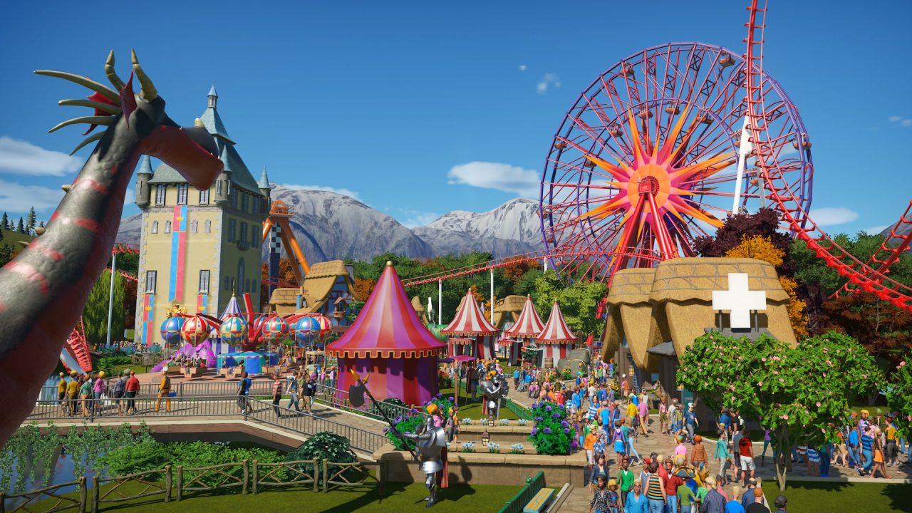 Platino di Planet Coaster: una ruota panoramica rossa sullo sfondo di un parco con montagne