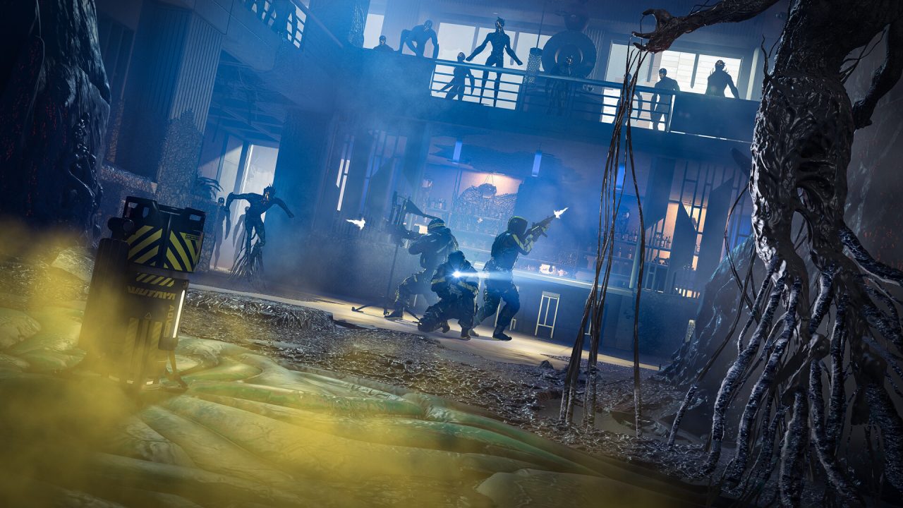 Platino di Rainbow Six Extraction: operatori in un ambiente illuminato di blu
