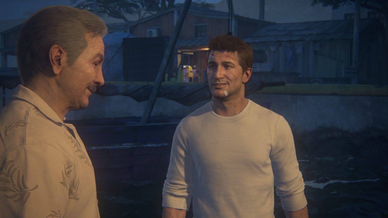 Platino di Uncharted Raccolta L'eredità dei ladri: Nathan parla con un uomo su una barca
